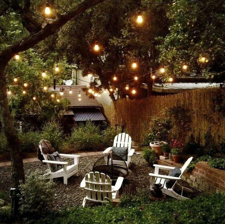 Transform your backyard design with a cozy outdoor seating area under twinkling lights