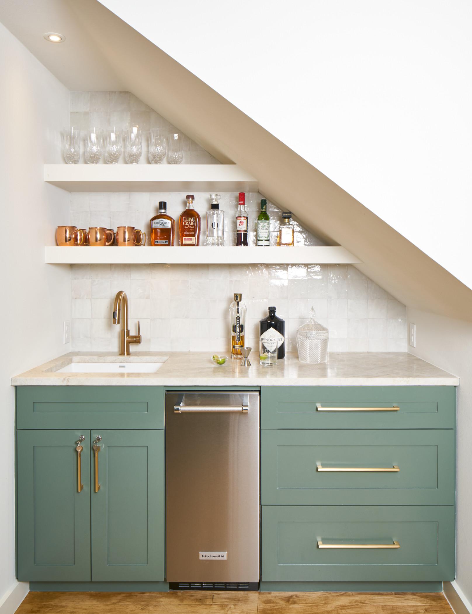 Incorporate a stylish bar area under stairs kitchen for entertaining guests