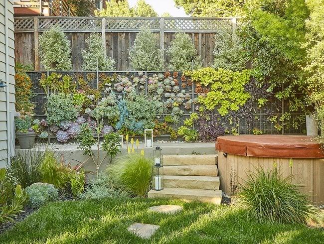 Use vertical gardens to maximize space and creativity in your backyard design