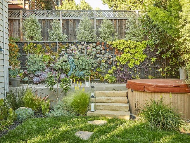 Use vertical gardens to maximize space and add greenery to your backyard design