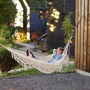 Introduce a hammock for relaxation and leisure in your backyard design