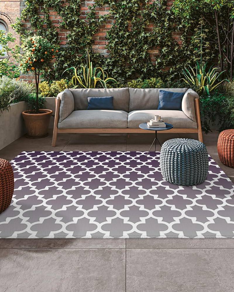 Use outdoor rugs to define spaces and add warmth to your backyard design