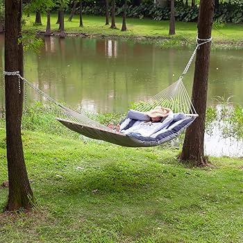 Add a hammock for lazy afternoons and relaxation in your backyard⁣ design