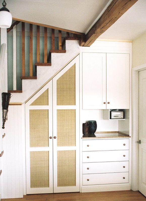 Utilize vertical storage options to save space in your Under Stairs Kitchen