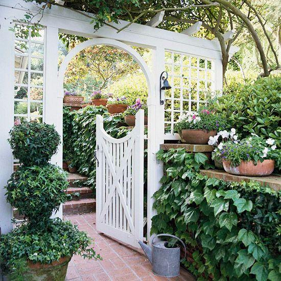 Add an archway or trellis for depth in your front yard design