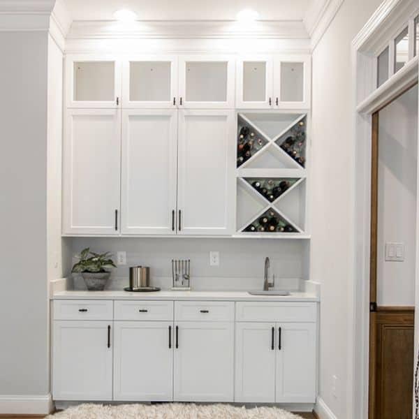 Elegant glass-front cabinets showcasing decorative ⁤dishware in your sophisticated modern​ kitchen