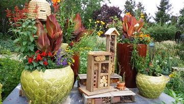 Add a bee hotel to promote biodiversity ⁤in your modern backyard ​oasis