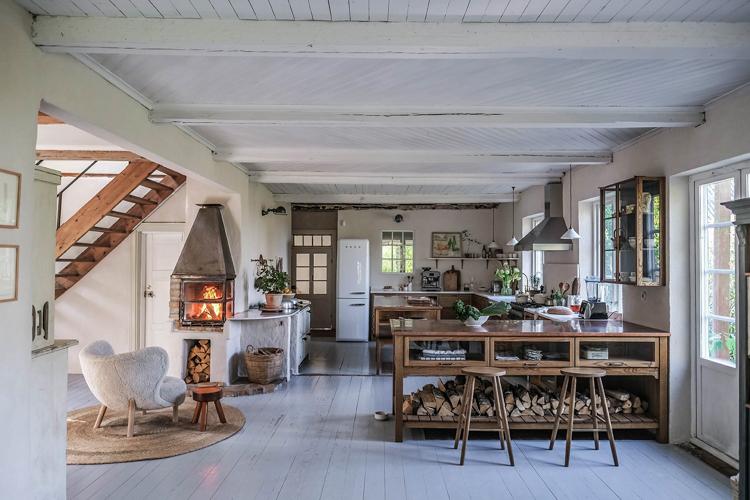 A wood-burning stove creates a cozy focal point in your country kitchen