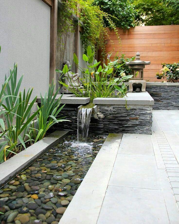 Introduce a water feature to bring peace to your modern backyard