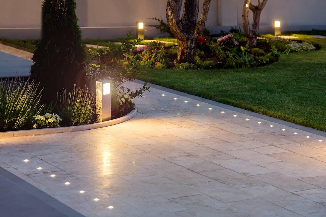 Incorporate ‌outdoor⁢ lighting to enhance ⁢nighttime beauty in ⁣your landscaping design