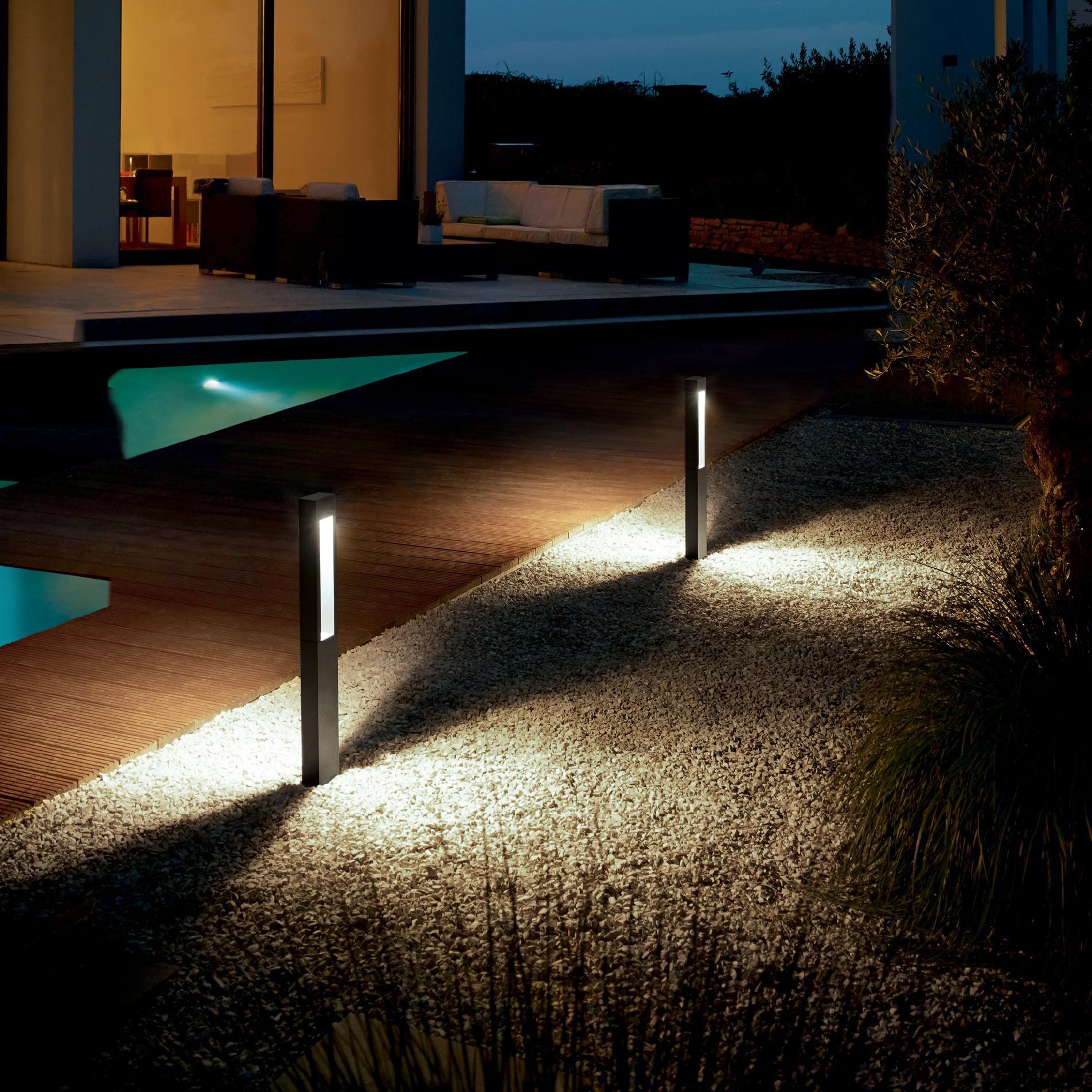 Introduce outdoor lighting to create a magical ambiance in your modern backyard