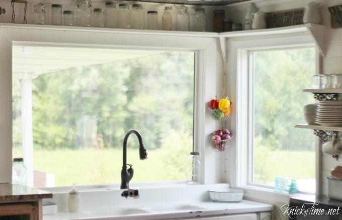 A farmhouse kitchen window lets in light and offers‍ picturesque views ‌outside