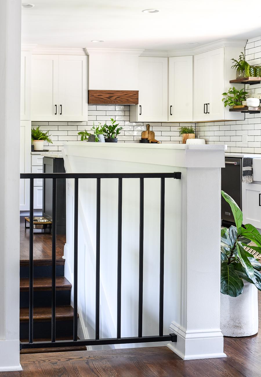 Integrate the under stairs kitchen with adjacent rooms for an open concept vibe