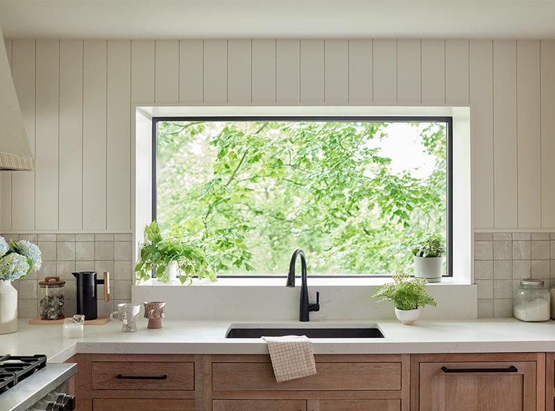 A farmhouse kitchen ⁢garden window to ⁤bring ⁢in natural‍ light and herbs