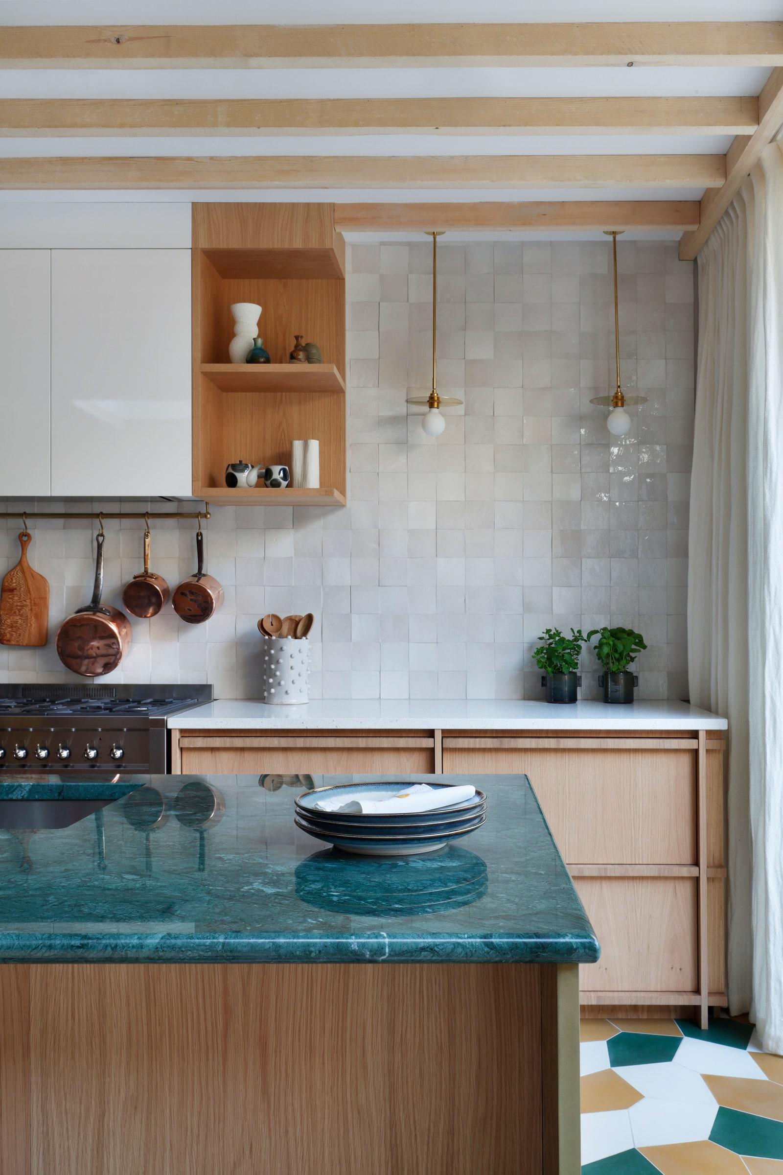 A stylish range hood becomes a striking focal point in your modern kitchen