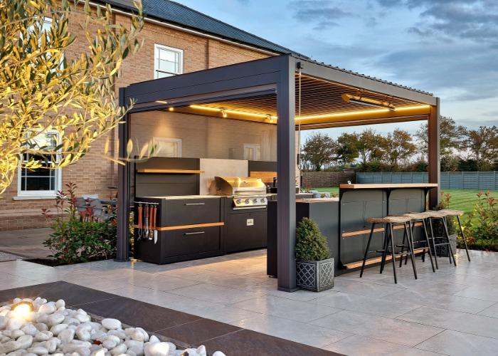 Include a chic outdoor kitchen for gourmet grilling in your modern backyard