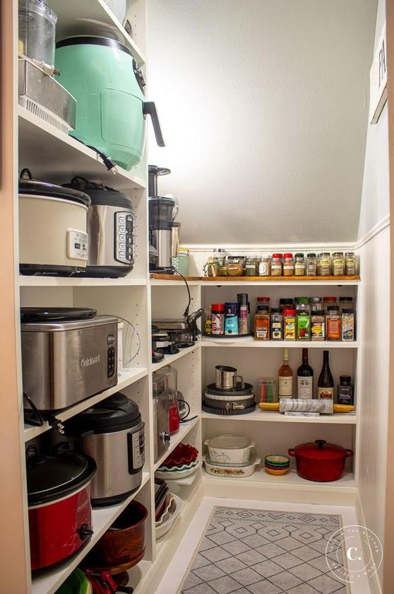 Install open shelving to showcase cookware in your Under Stairs Kitchen