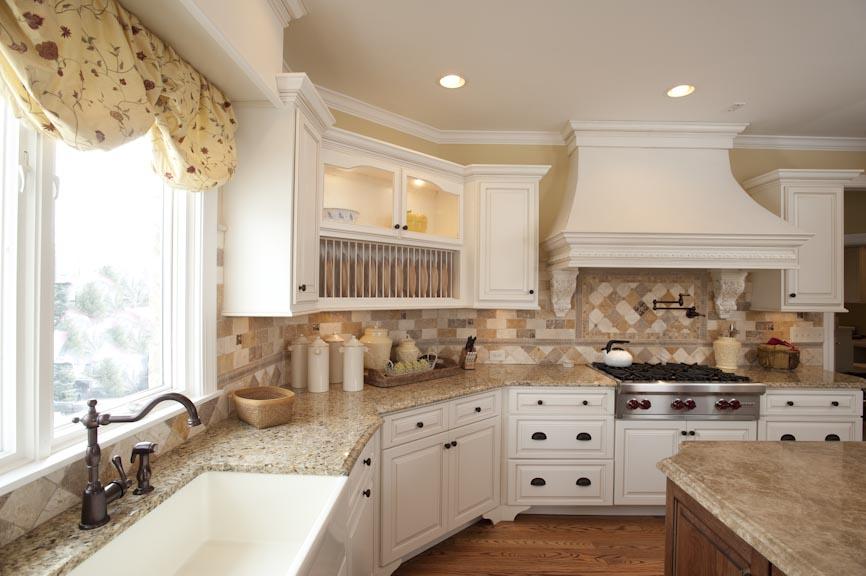 Handcrafted cabinetry ​provides unique appeal in your stylish country kitchen