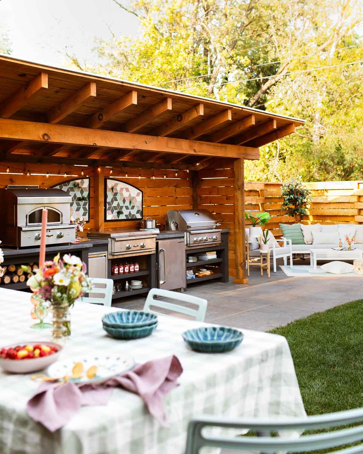 Create an outdoor kitchen to elevate your backyard design for entertaining friends