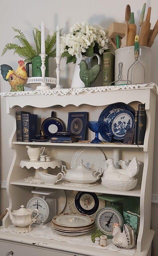 A classic farmhouse⁢ hutch displays collectibles‌ in your country kitchen