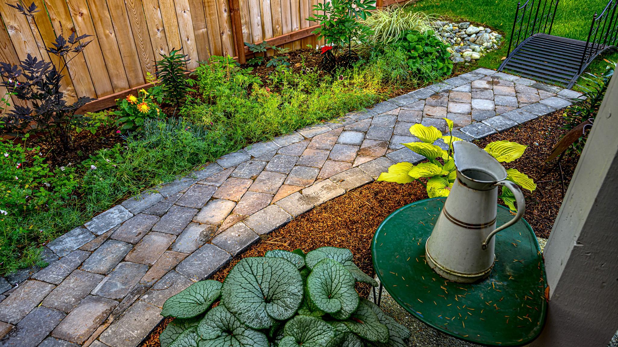 Blend different materials for pathways to add interest to your landscaping design