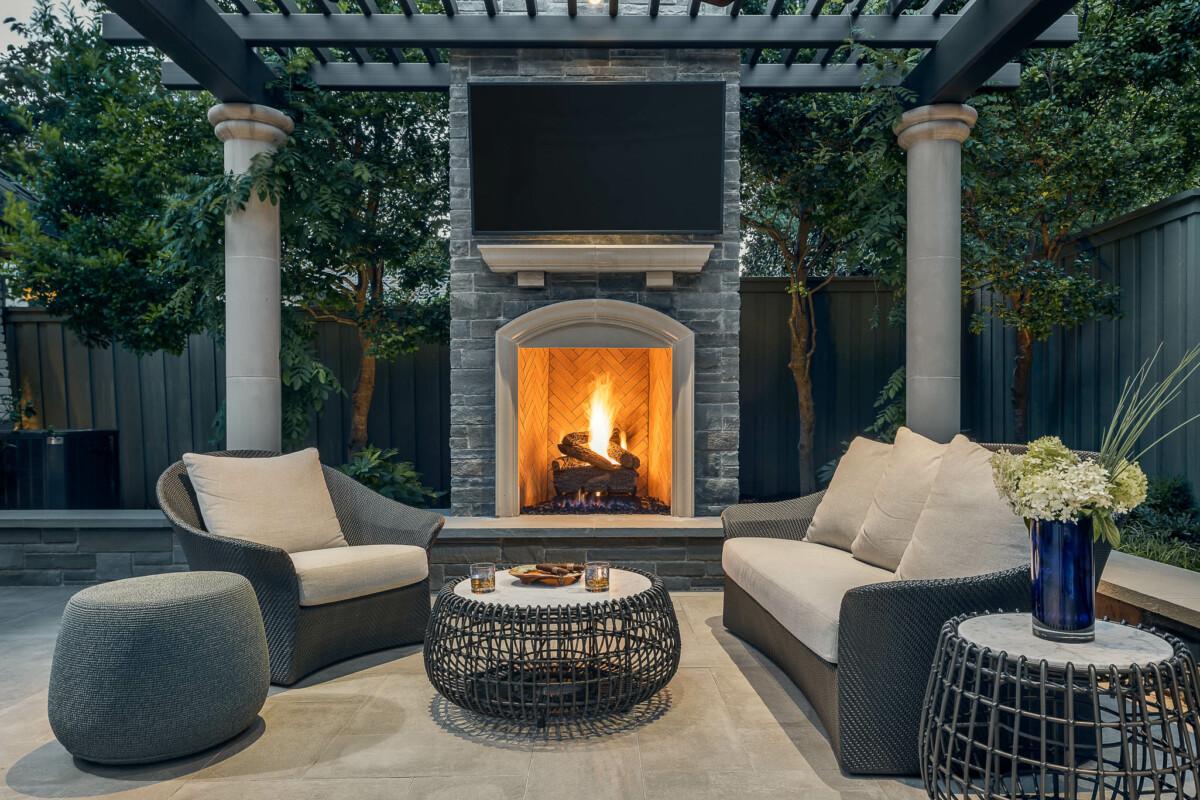 Create a cozy fireplace patio design for warmth and gatherings year-round