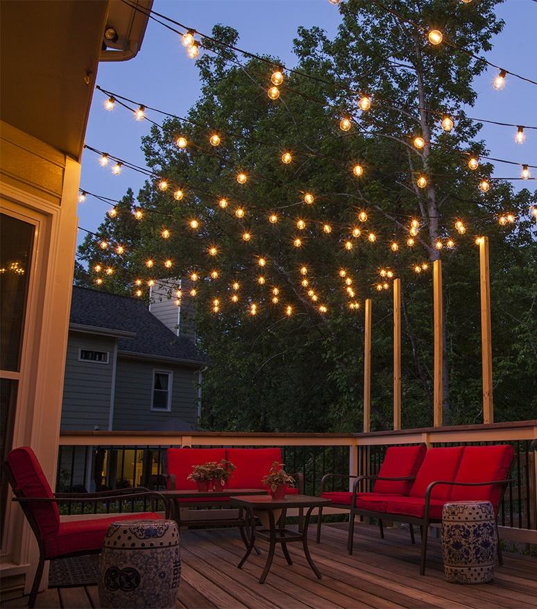 Hang string lights for a magical ​ambiance in your patio design