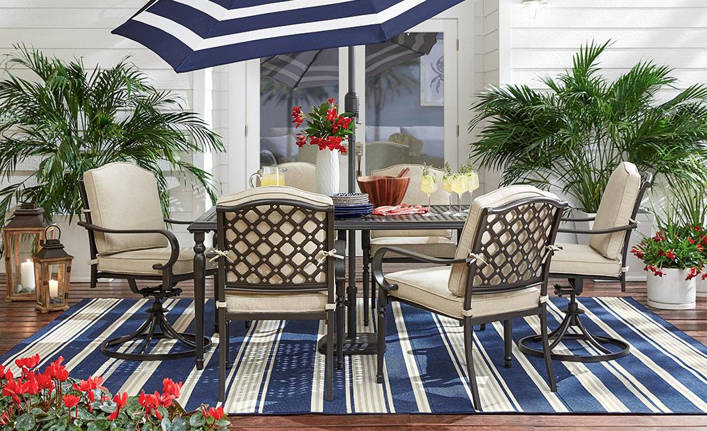 Utilize outdoor rugs to define spaces and add warmth to your patio design