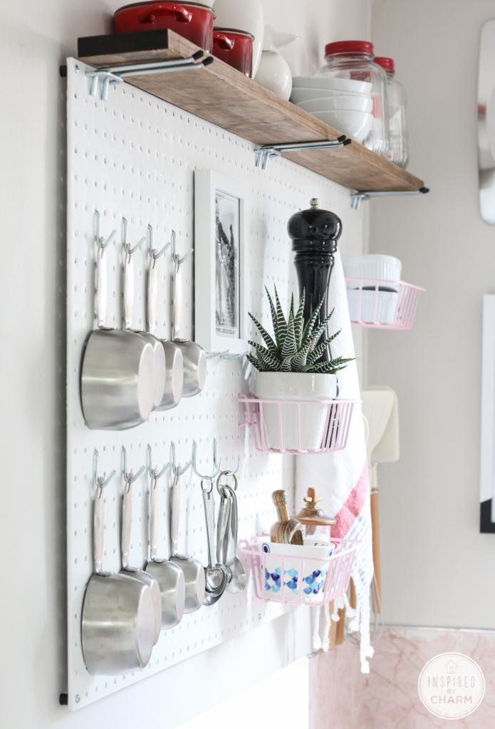 Incorporate a pegboard for organized kitchen tools in ​your galley kitchen