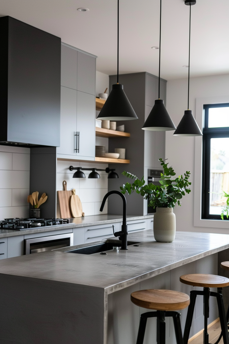 Small white pendant lights above a marble island