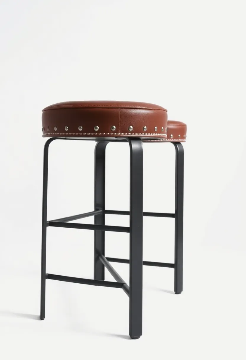 Bold Industrial Stools with Riveted Detailing and Smooth Leather‍ Cushions