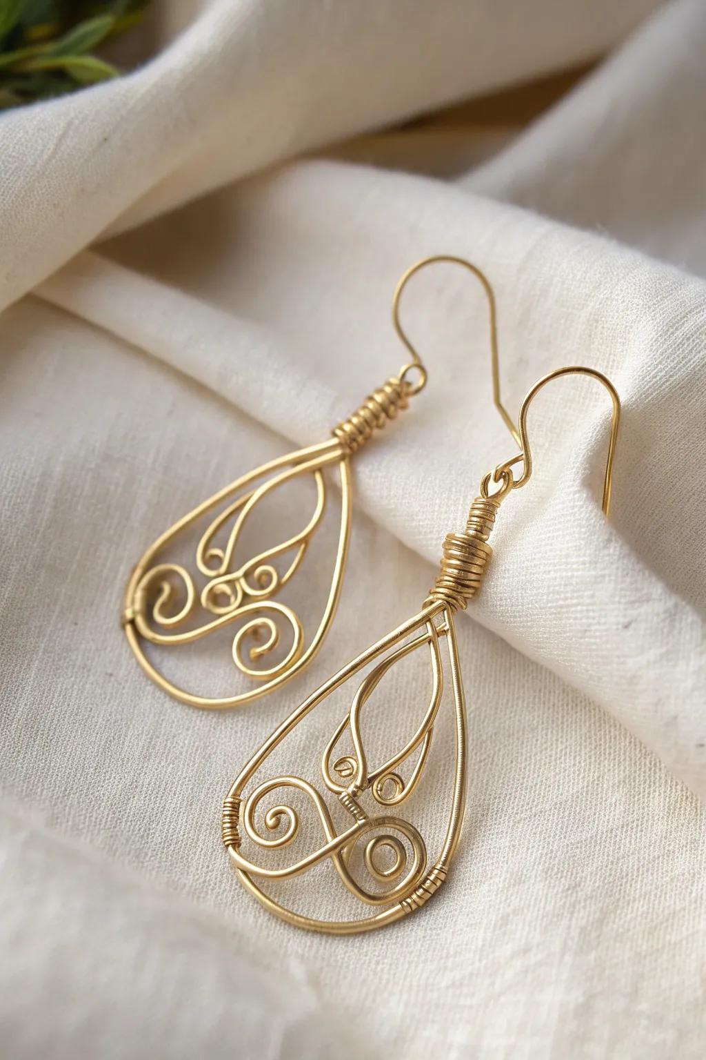 Handcrafted wire earrings featuring graceful spiral designs that blend simplicity with sophistication.