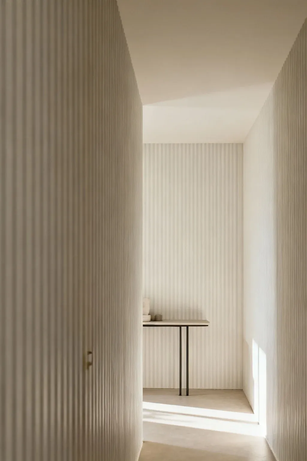 A short hallway featuring vertical stripes that create an illusion of height.