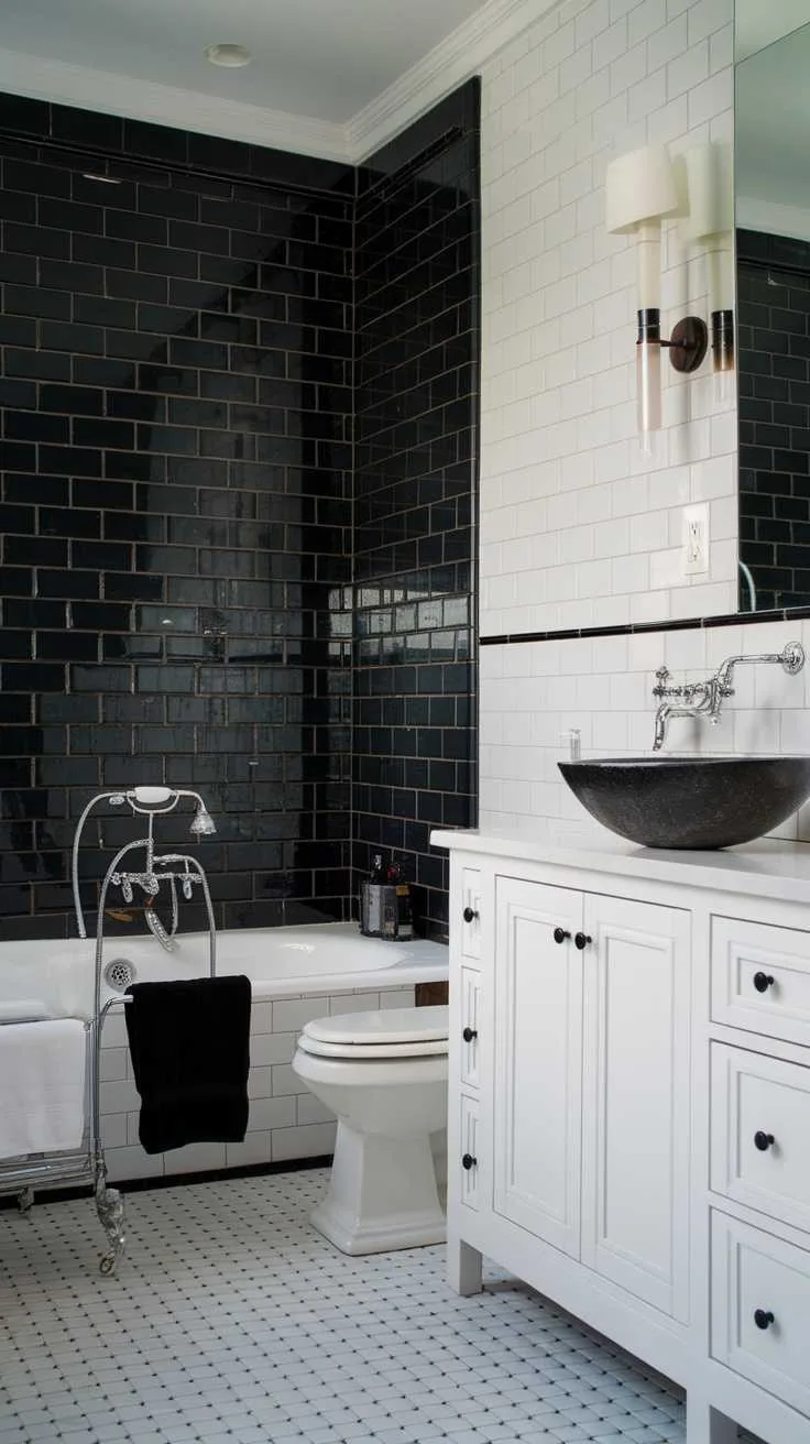 Bathroom with black tile accent walls and white vanity