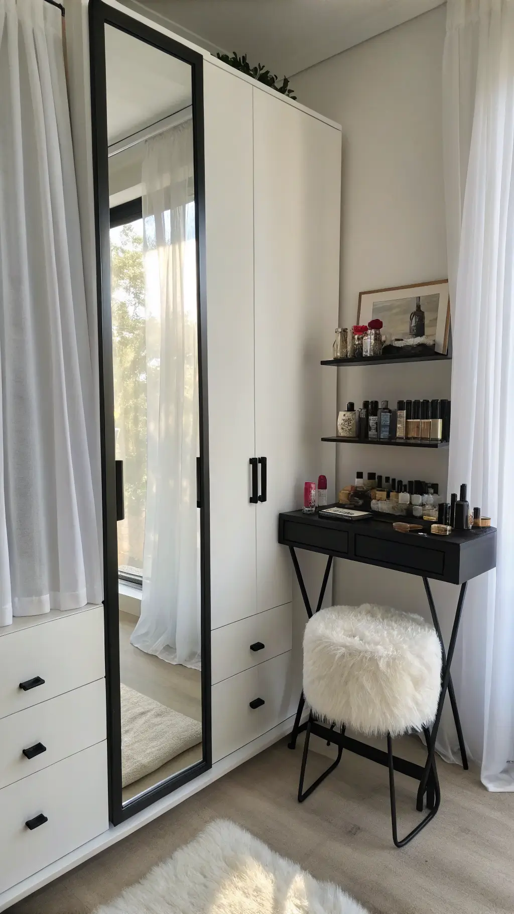 Dramatic dressing area with morning light reflecting off a black-framed mirror, white wardrobe, faux fur stool, black shelf with perfume bottles and jewelry, filtered by sheer curtains