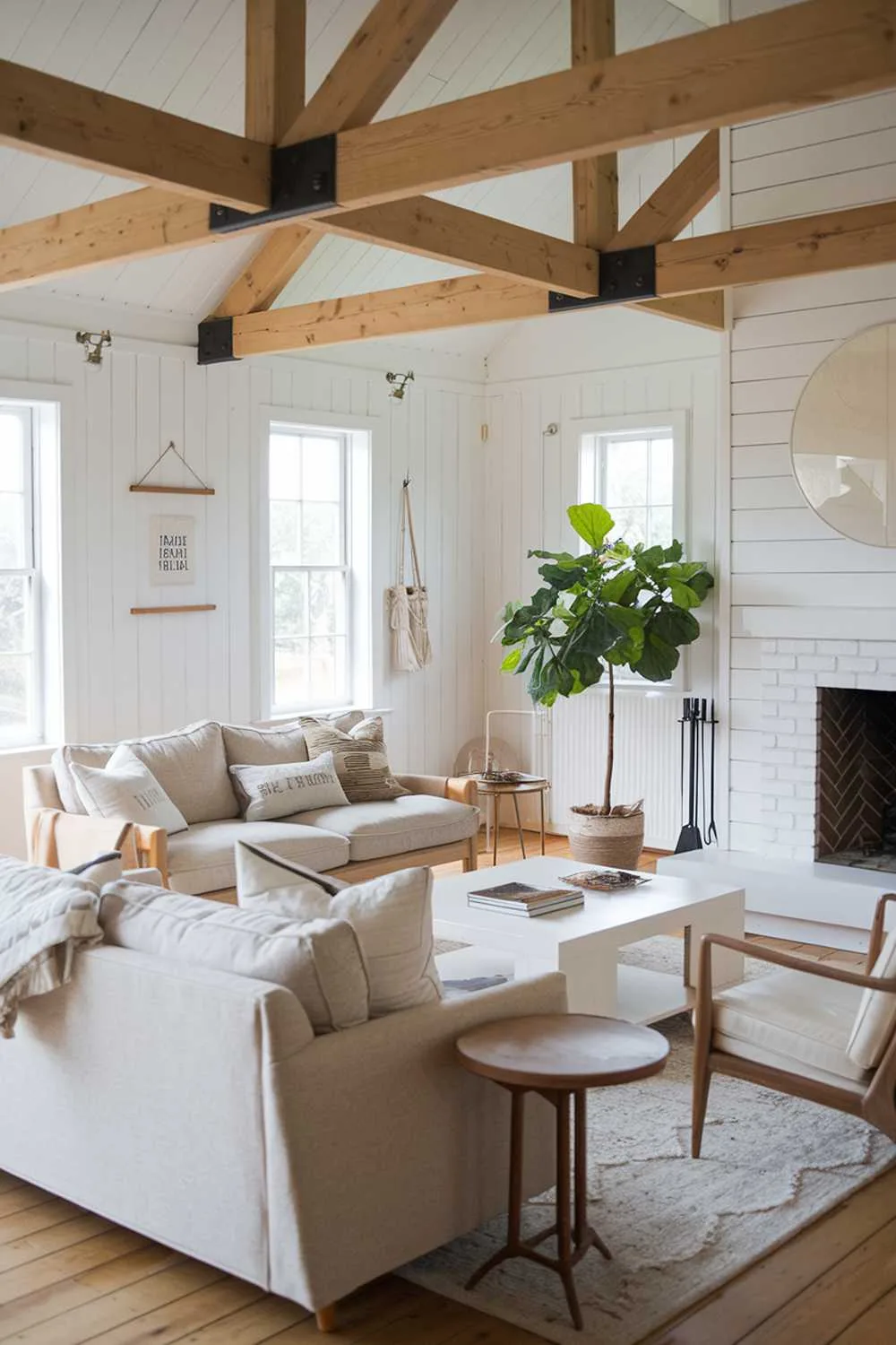 Scandinavian farmhouse living room with white fireplace and wooden beams