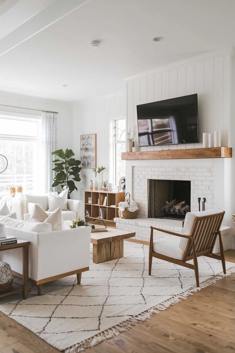 Scandinavian farmhouse living room with fireplace and wall-mounted TV