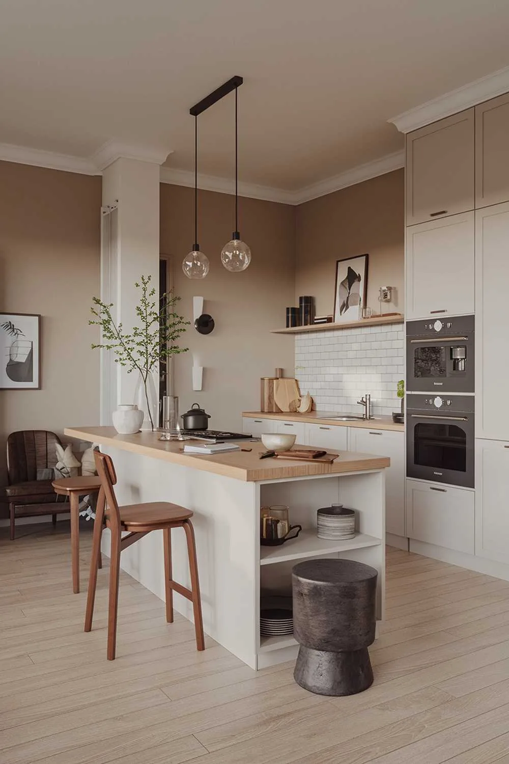 Scandinavian kitchen with wood-topped island, white cabinets, dark gray oven, and warm lighting