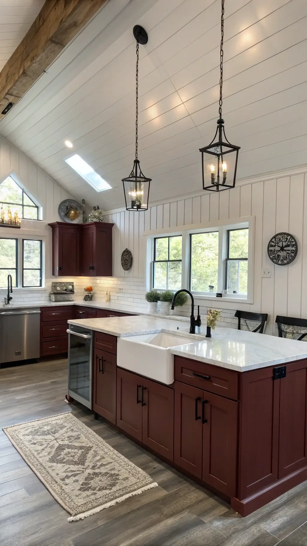 Contemporary farmhouse kitchen with burgundy shaker cabinets, soapstone countertops, white island with ceramic sink, black iron hardware, and vertical shiplap accent wall