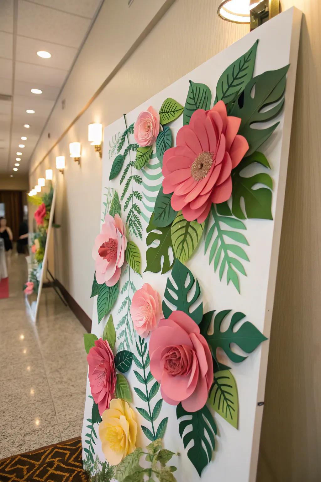 A board decorated with large paper flowers and lush greenery.