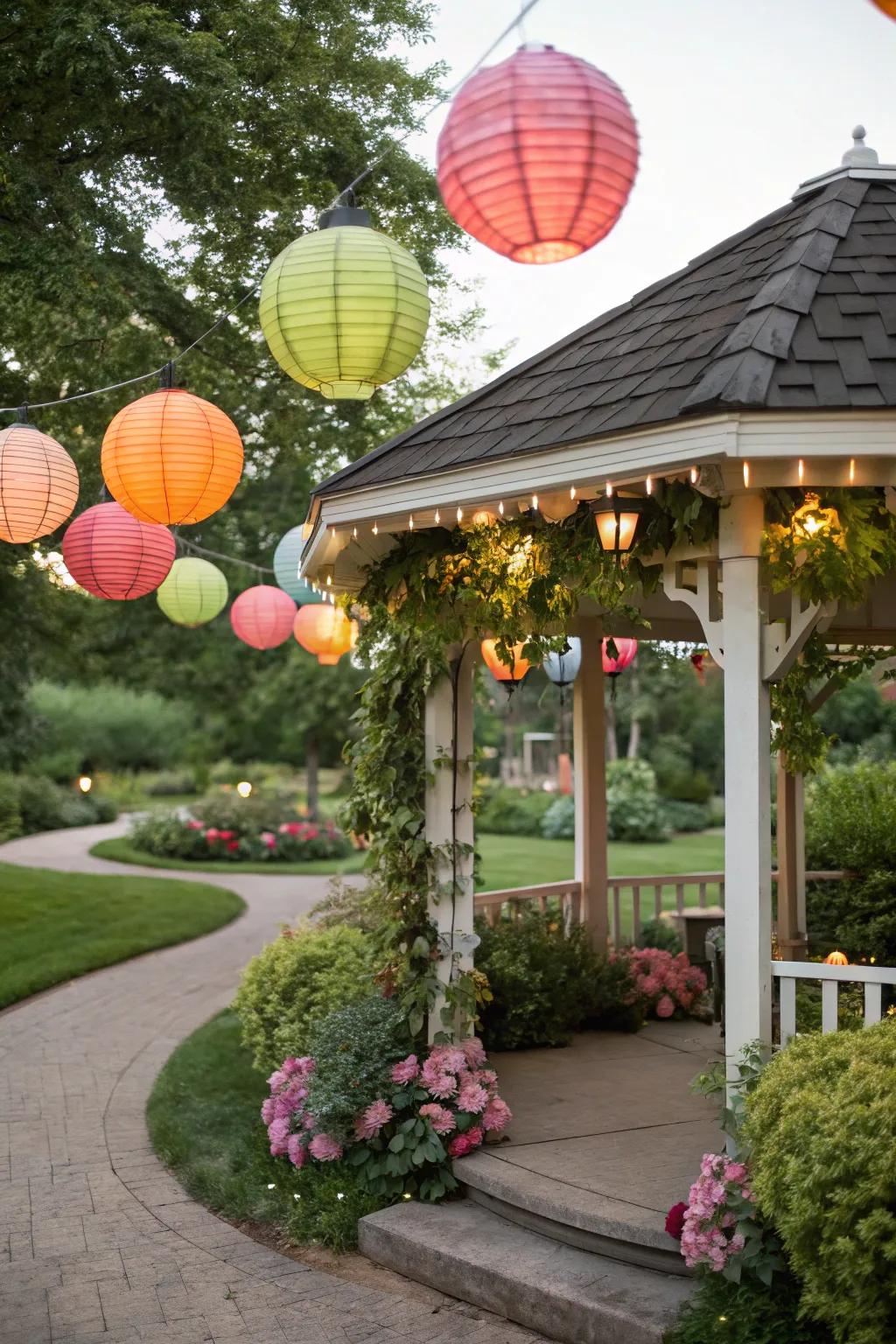 Colorful paper lanterns hanging in a gazebo.