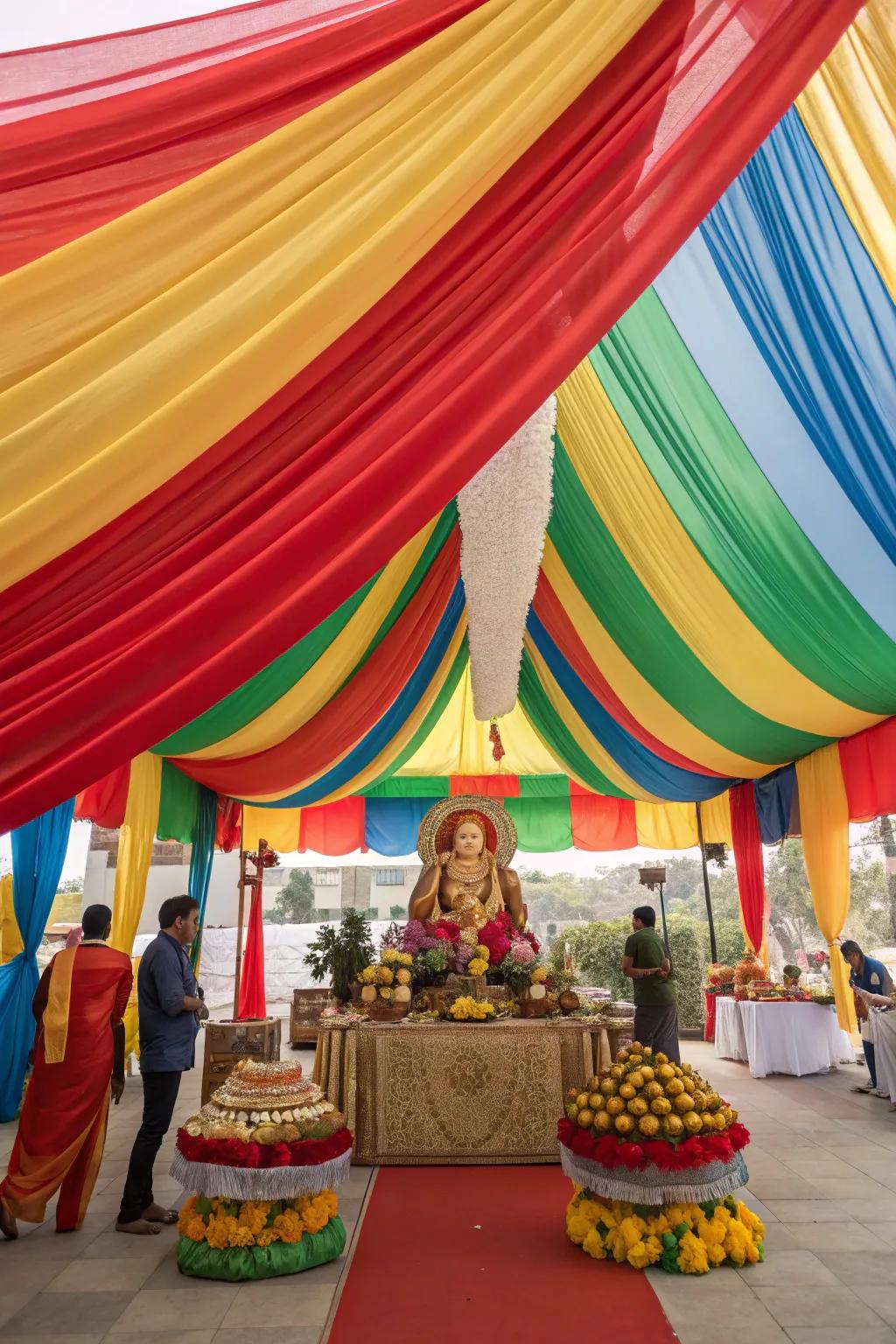 Colorful fabric drapes forming a festive canopy over the Ganesh Chaturthi altar.