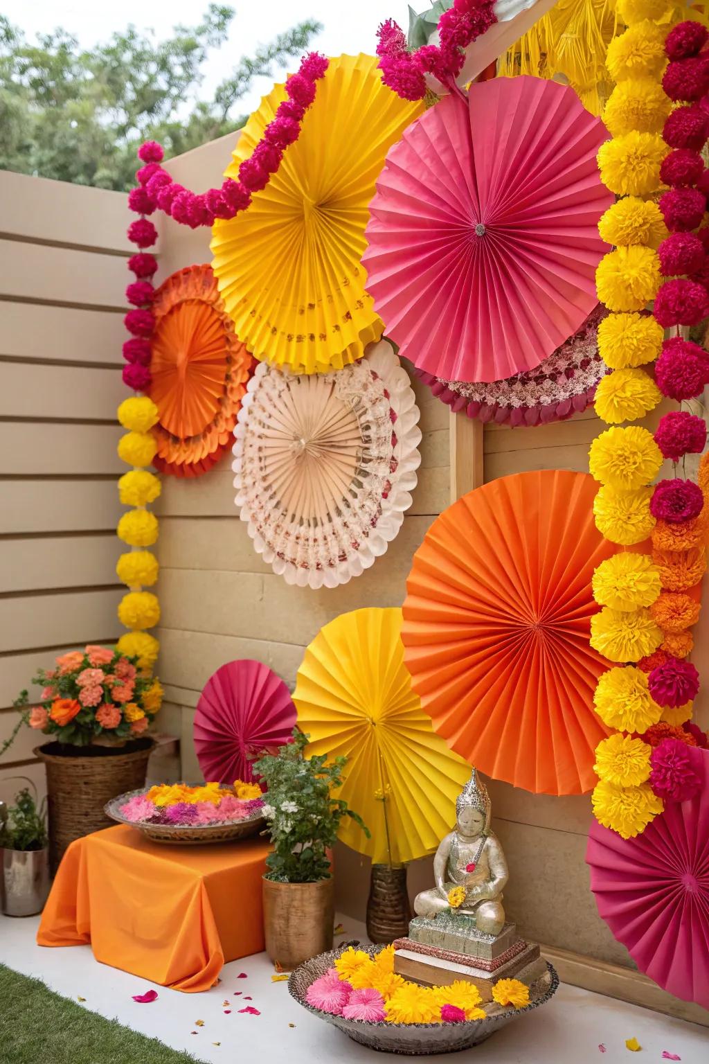 Colorful paper flowers and fans creating a cheerful backdrop for Ganesh Chaturthi.