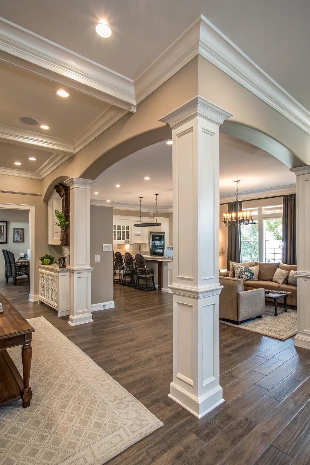 An open-concept living area featuring wide crown molding, adding grandeur and cohesion.