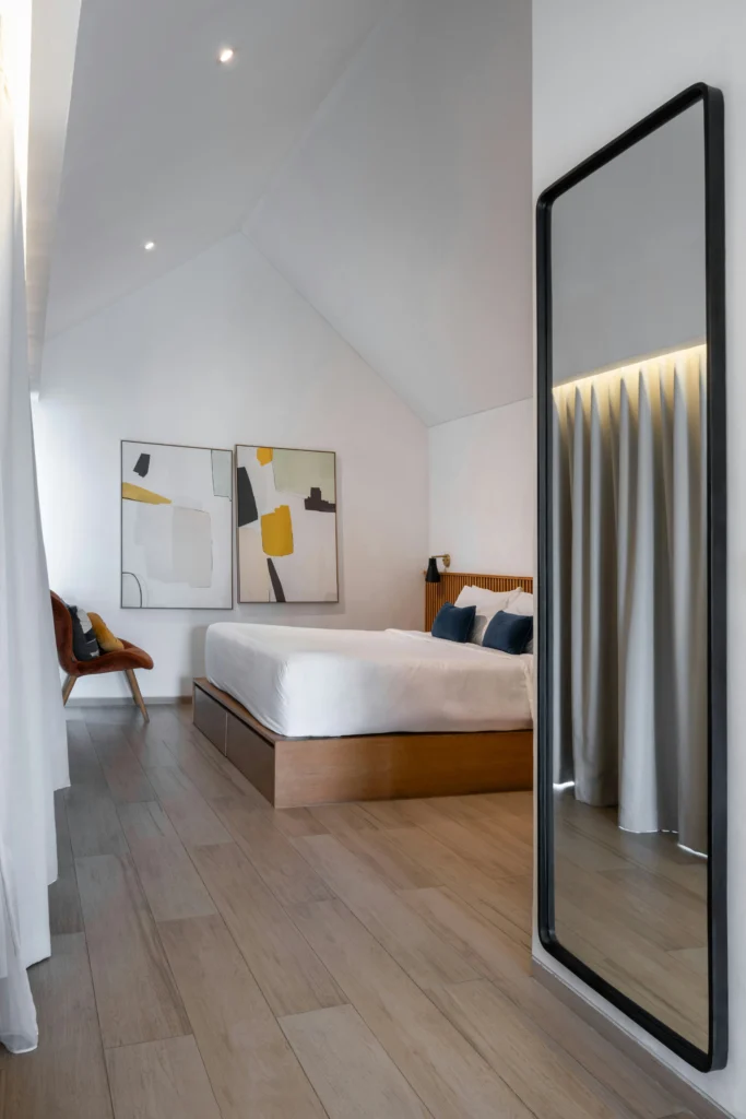Bedroom with Vaulted Ceiling and Abstract Art