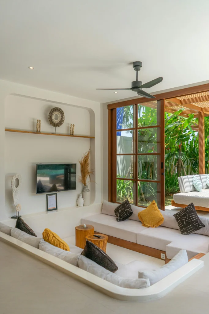Sunken Lounge with Tropical Plants and Bright Accents