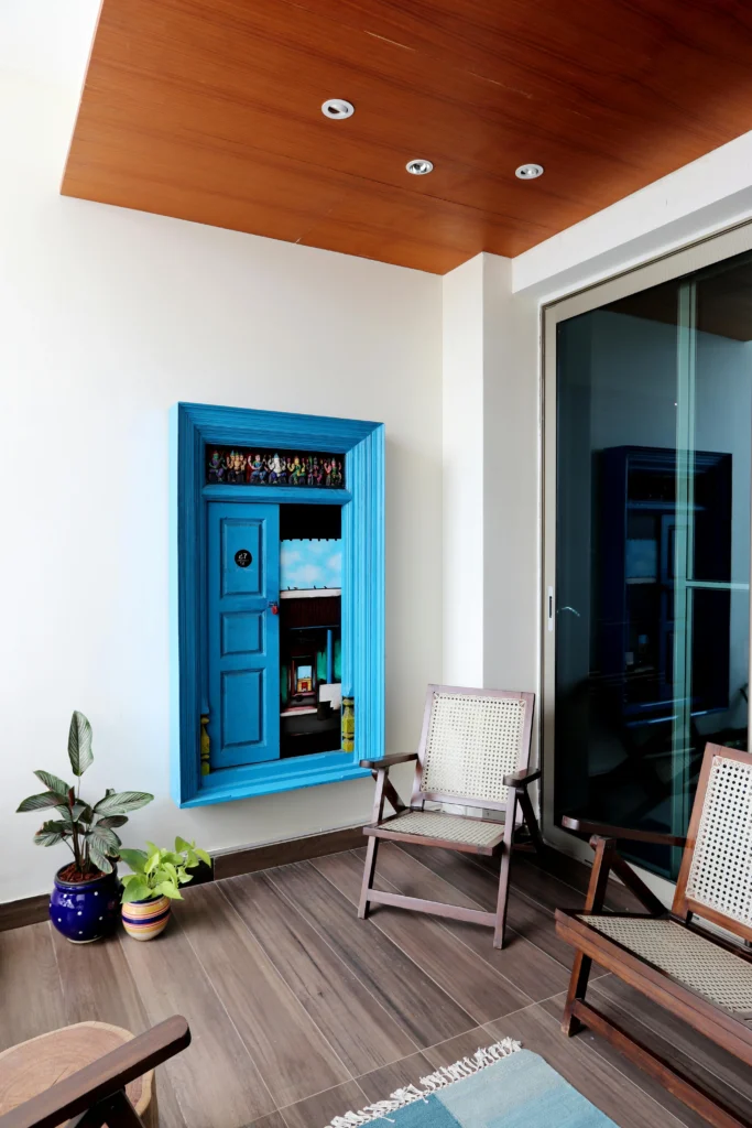 Bright Artistic Corner with Blue Door Artwork and Cane Chairs
