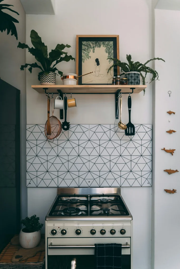 Kitchen with geometric backsplash and green plants