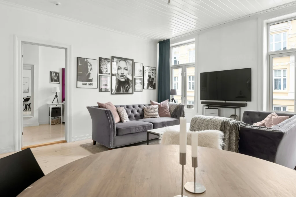 Glamorous monochrome living room with tufted velvet sofa
