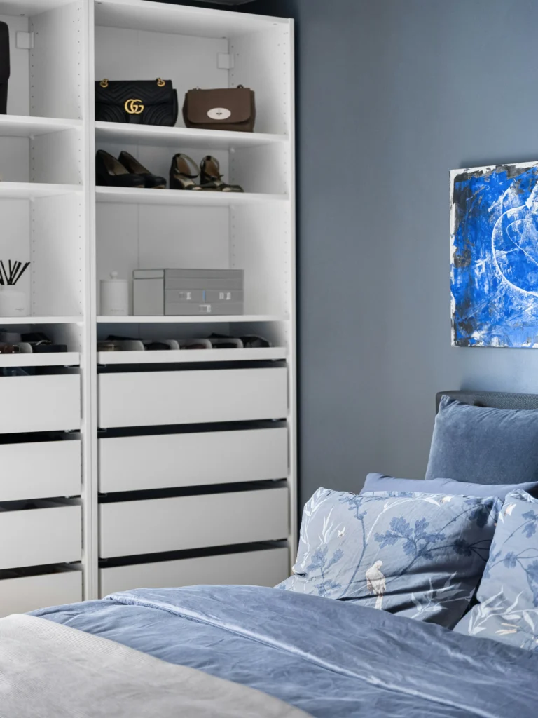 Under-bed storage bins in a small bedroom